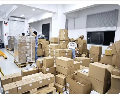 Staff palletizing export cartons in the warehouse