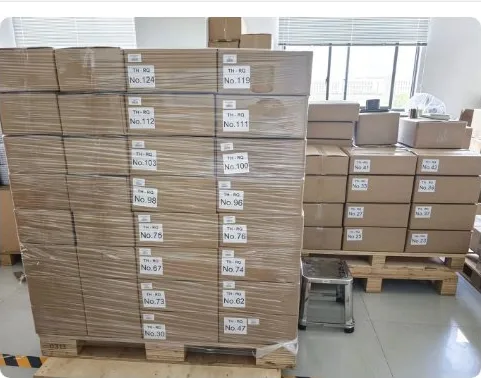 Stretch-wrapped export pallets with labels stacked for dispatch